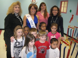 Left to right: Deanna Saylor, Day Nursery State Center Director, Miss Indiana Megan Meadors, Marti Thiery, Day Nursery Asst. Director and Amy Cavin, Day Nursery Office Manager with preschool children.